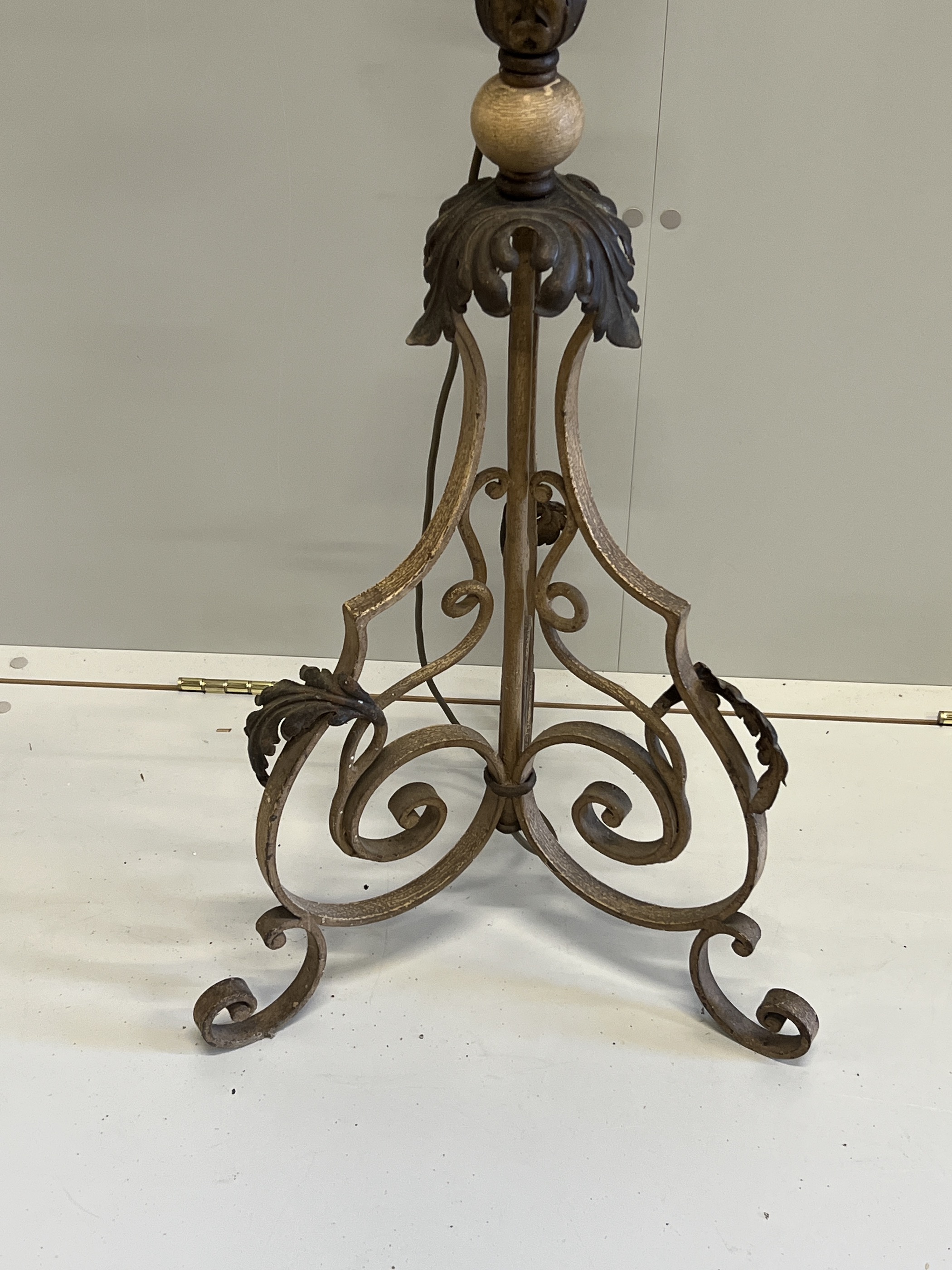 An early 20th century French wrought iron telescopic standard lamp